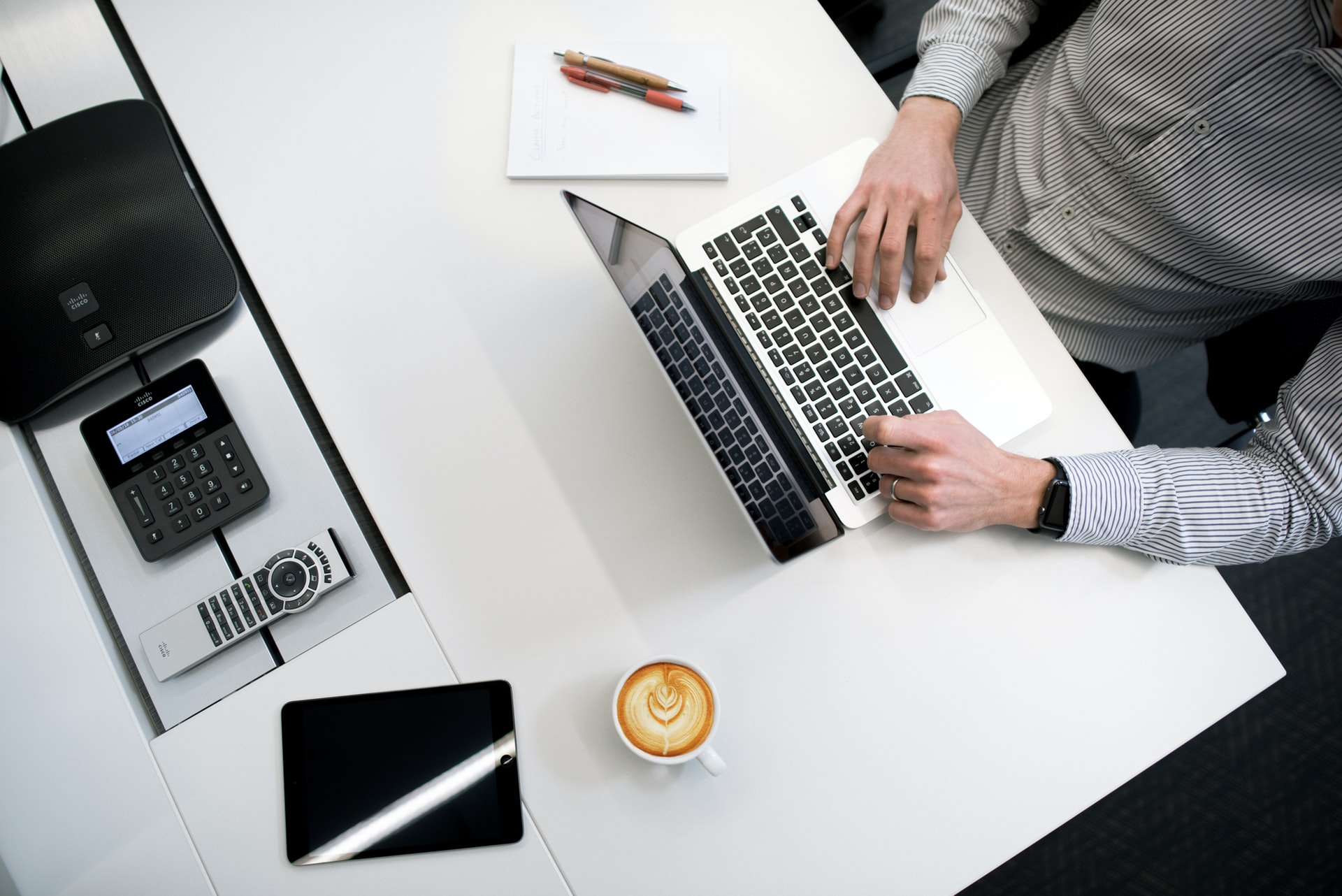 Digital workspace with laptop and coffee